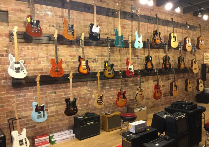 Electric and acoustic guitars at Crossroads Guitar Shop in Salt Lake City, UT