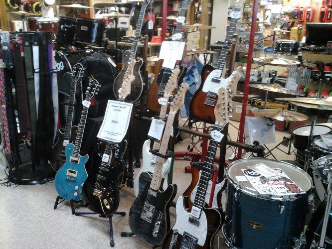 Michael Kelly 1950s and 1960s electric guitars at Stan Herber's Music Shoppe in Hammond, LA, inlcuding several lefty guitars