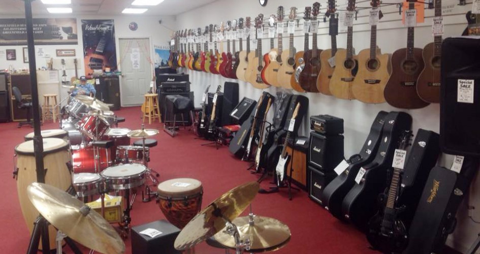 Acoustic and electric guitars at Greenfield Music and Amps guitar store