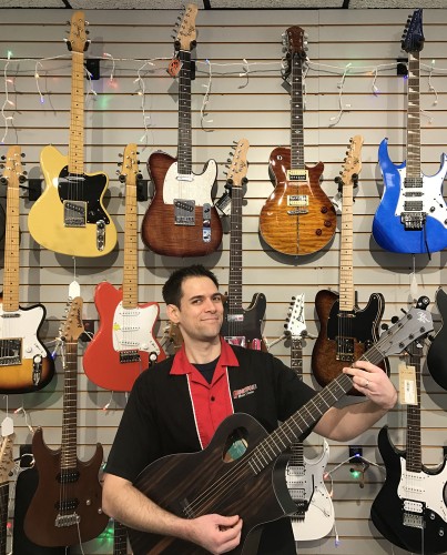 Michael Kelly 1950s electric guitars, Patriot electric guitars, and Java Ebony acoustic guitars at Brighton Music Center store in New Brighton, PA
