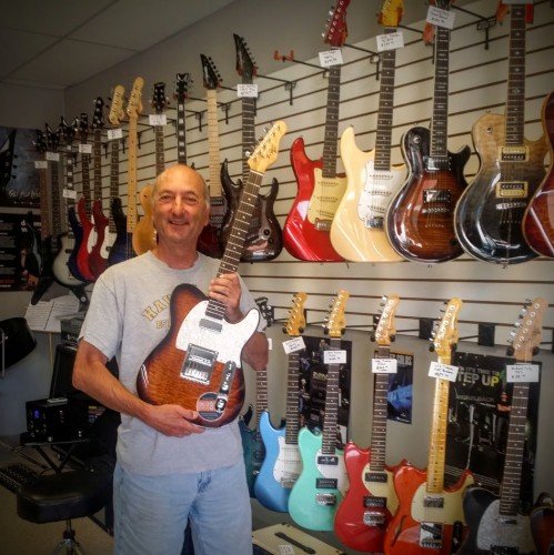 Michael Kelly guitar player with his 1955 Caramel Burst electric guitar