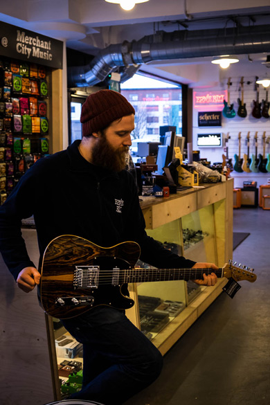 Merchant City Music staff playing with an MK 1950s Ebony electric guitar Merchant City Music staff playing with an MK 1950s Ebony electric guitar