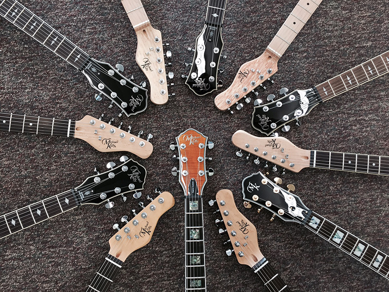 Michael Kelly guitar headstock circle Michael Kelly guitar headstock circle