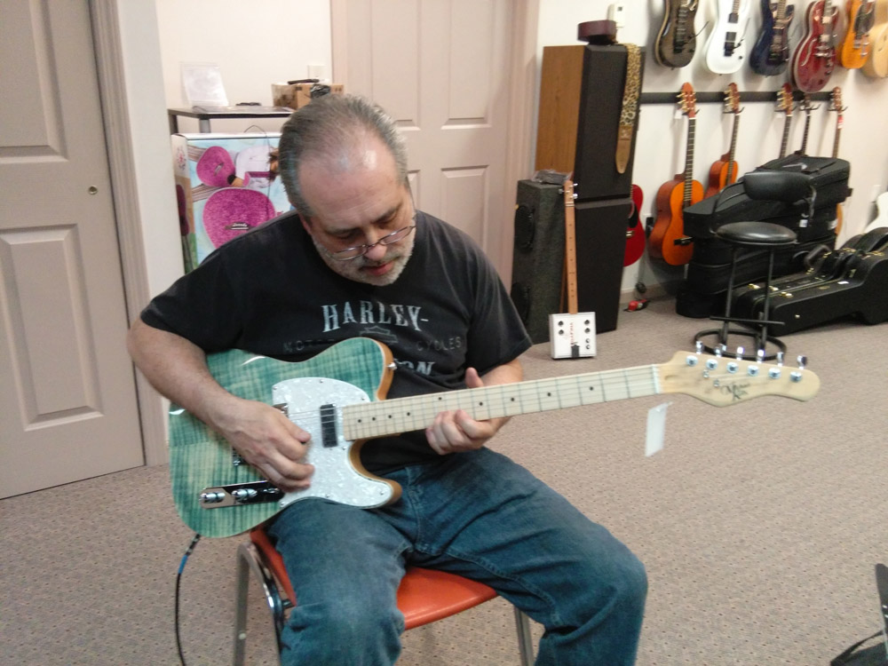 Student with a Michael Kelly 1950s electric guitar during guitar lessons at Robert Putt Studios. Student with a Michael Kelly 1950s electric guitar during guitar lessons at Robert Putt Studios.