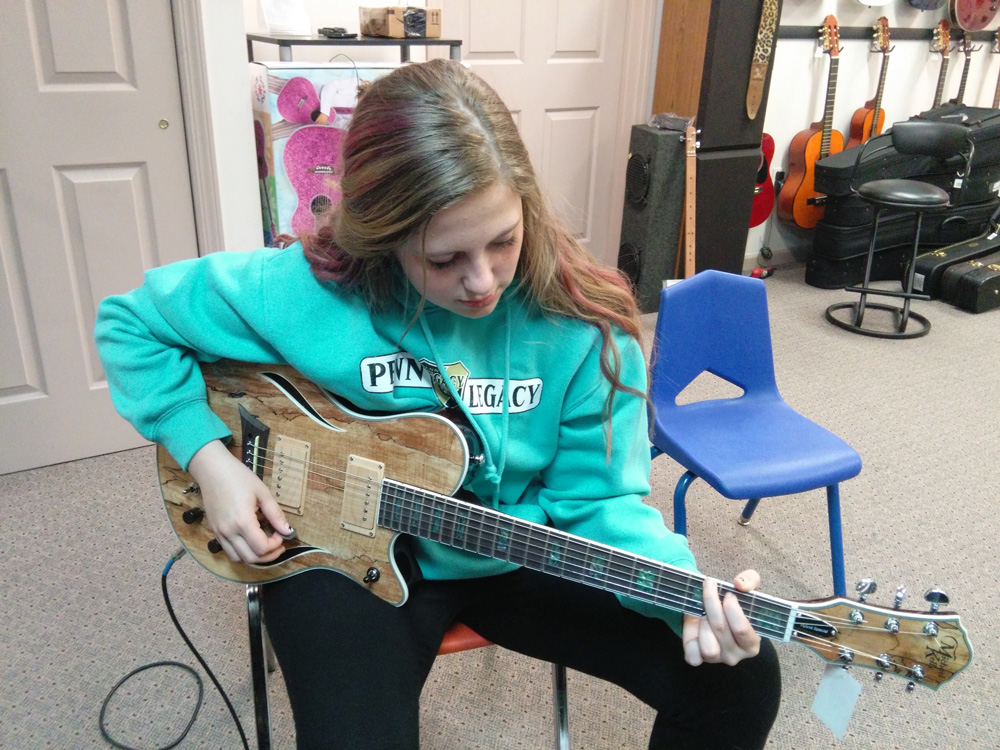 Guitar lessons at Robert Putt Studios with a Michael Kelly Hybrid Acoustic-Electric