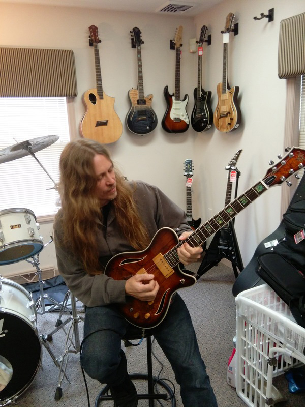 Robert Putt playing a Michael Kelly Hybrid acoustic electric guitar Robert Putt playing a Michael Kelly Hybrid acoustic electric guitar