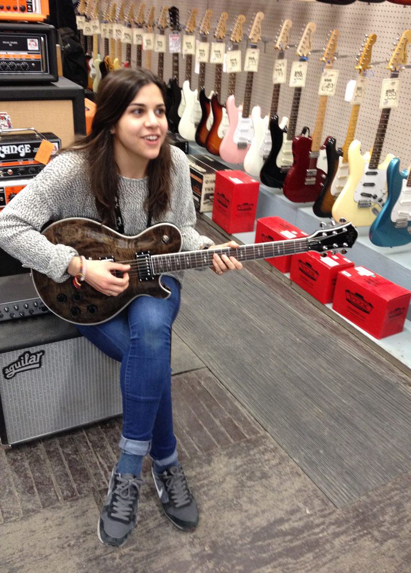 Steve's Music staff with a Michael Kelly Patriot electric guitar