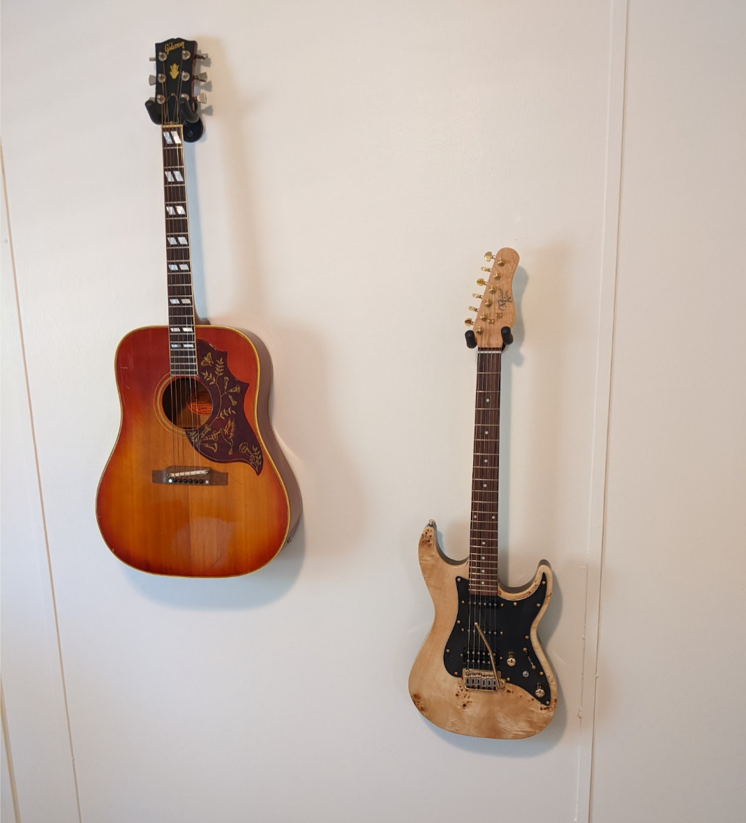 open photo of My new Michael Kelly 60 Burl Ultra and my 1966 Gibson Hummingbird in a popup