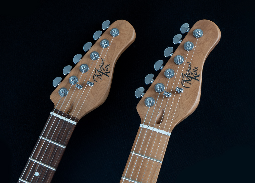 two electric guitar headstocks