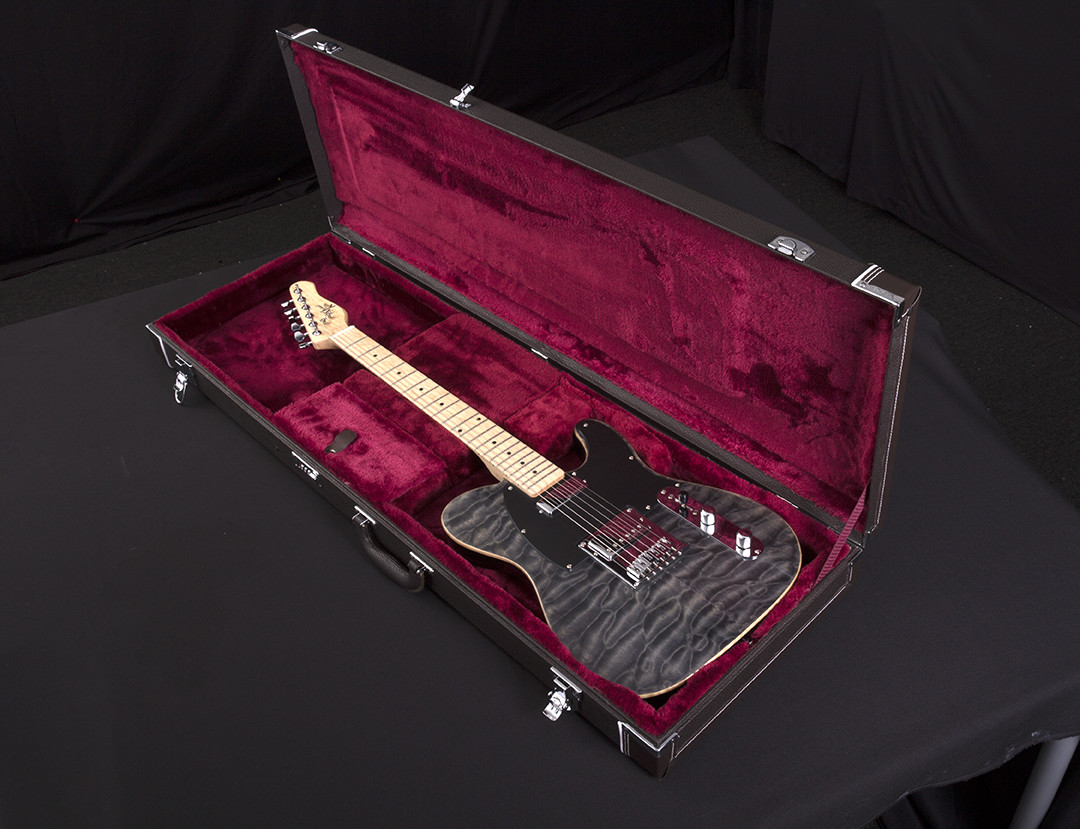 electric guitar in open hard case