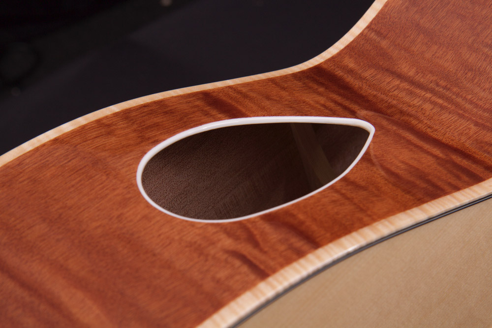 closeup of sound hole on acoustic guitar